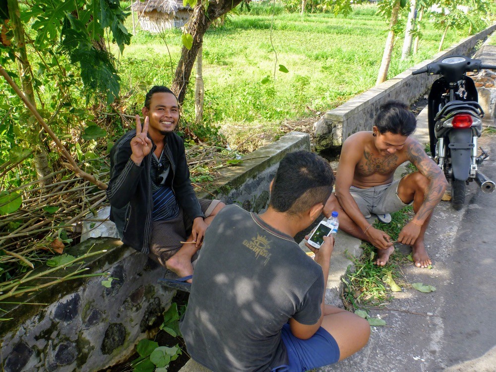 Indonesian men taking a break in the shade